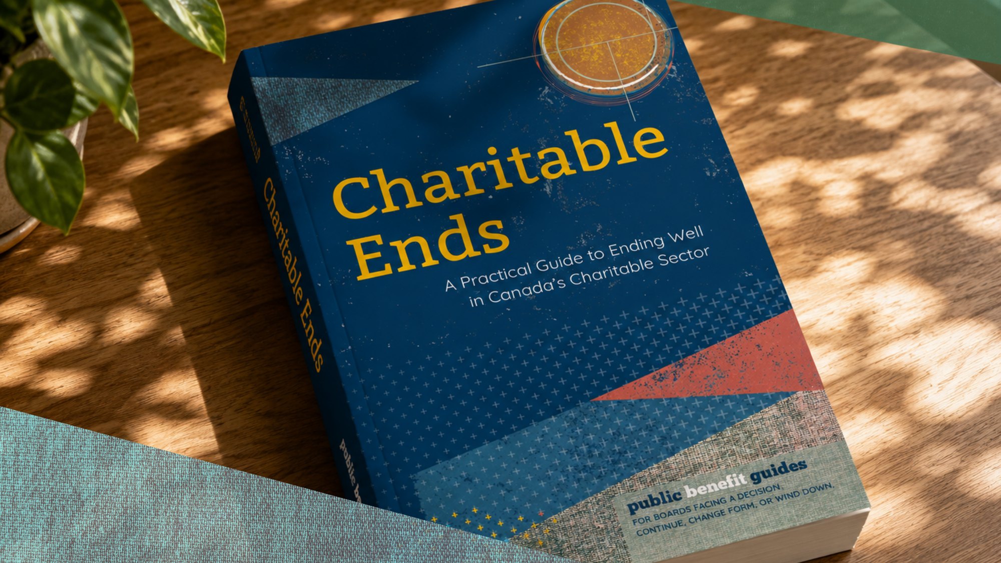 Charitable Ends, the softcover, on a wooden table